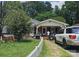 House exterior with a yard, white picket fence, and driveway at 800 Thera Dr, Charlotte, NC 28206