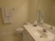 Bright bathroom featuring neutral walls, tiled floor, and a single sink vanity at 8620 Robinson Forest Dr, Charlotte, NC 28277