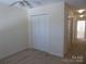 Bedroom with neutral carpet and closet at 8620 Robinson Forest Dr, Charlotte, NC 28277