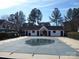 Gated community pool is covered for the winter season in front of a clubhouse at 8620 Robinson Forest Dr, Charlotte, NC 28277