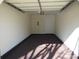 Bright, clean single-car garage with epoxy floors and neutral walls at 8620 Robinson Forest Dr, Charlotte, NC 28277