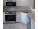 Modern kitchen featuring stainless steel appliances, sink, and white cabinets at 8620 Robinson Forest Dr, Charlotte, NC 28277