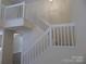 Bright foyer with white staircase at 8620 Robinson Forest Dr, Charlotte, NC 28277