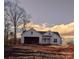 White farmhouse exterior with a two-car garage at 9062 Mccray Farms Dr, Hickory, NC 28601