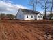 White sided home with gray roof and landscaping at 9062 Mccray Farms Dr, Hickory, NC 28601