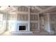 Unfinished living room with a fireplace and high ceilings at 9062 Mccray Farms Dr, Hickory, NC 28601