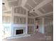 Unfinished living room with a fireplace and high ceilings at 9062 Mccray Farms Dr, Hickory, NC 28601