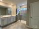 Elegant bathroom with double vanity, shower, and tile flooring at 9446 Avery Lilac Ln, Fort Mill, SC 29707