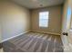 Simple bedroom with carpet and a window with blinds at 9446 Avery Lilac Ln, Fort Mill, SC 29707