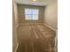 Well-lit bedroom featuring carpet and window with blinds at 9446 Avery Lilac Ln, Fort Mill, SC 29707