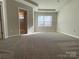 Spacious bedroom with carpet flooring and large window at 9446 Avery Lilac Ln, Fort Mill, SC 29707