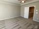 Bright bedroom featuring carpet floors and access to upper level at 9446 Avery Lilac Ln, Fort Mill, SC 29707