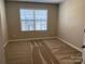 Cozy bedroom with carpet, window, and blinds at 9446 Avery Lilac Ln, Fort Mill, SC 29707