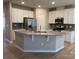 Island kitchen with stainless steel appliances and granite countertops at 9446 Avery Lilac Ln, Fort Mill, SC 29707