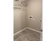 Laundry room with tile floor and shelving at 9446 Avery Lilac Ln, Fort Mill, SC 29707