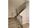 Elegant staircase with wrought iron railing and carpet at 9446 Avery Lilac Ln, Fort Mill, SC 29707