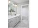 Bathroom featuring double vanity with gray cabinets, modern black fixtures, and tile flooring at 9957 Cask Way, Huntersville, NC 28078