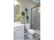 Modern bathroom with white vanity, gray tile shower, and decorative plants at 9957 Cask Way, Huntersville, NC 28078