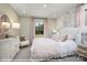 Cozy bedroom with a white shell headboard, soft pink bedding, and a decorative wall at 9957 Cask Way, Huntersville, NC 28078