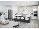 Spacious kitchen island with seating, stainless steel appliances, and white cabinetry at 9957 Cask Way, Huntersville, NC 28078