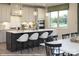 Modern kitchen with white cabinets, a large island, and quartz countertops at 9957 Cask Way, Huntersville, NC 28078