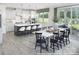 Bright kitchen boasts an island and adjacent dining area with backyard view at 9957 Cask Way, Huntersville, NC 28078