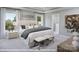 Large main bedroom with plush bed, ensuite bathroom, and large windows at 9957 Cask Way, Huntersville, NC 28078