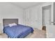 Simple bedroom with a blue bed and access to hallway at 1037 Tobin Dr, Fort Mill, SC 29715