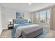 Bright bedroom features a large bed, bedside tables, and a bench seat at 1037 Tobin Dr, Fort Mill, SC 29715