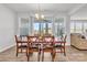 Dining room with a wooden table and chairs, large window and sliding door at 1037 Tobin Dr, Fort Mill, SC 29715