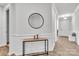 Bright entryway with a round mirror and wood console table at 1037 Tobin Dr, Fort Mill, SC 29715