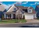 Two-story house with gray siding, a white front door and a two-car garage at 1037 Tobin Dr, Fort Mill, SC 29715