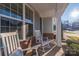 Relaxing front porch with two rocking chairs and side table at 1037 Tobin Dr, Fort Mill, SC 29715