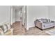 Light-filled hallway with wood flooring, leading to other rooms at 1037 Tobin Dr, Fort Mill, SC 29715