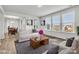 Bright and open living room featuring large windows, neutral colors and hardwood flooring at 1037 Tobin Dr, Fort Mill, SC 29715