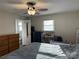 Main bedroom with king bed, dresser, and access to bathroom at 108 Greenview Dr, Kannapolis, NC 28081