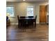 Dining room with hardwood floors and a dark wood table at 108 Greenview Dr, Kannapolis, NC 28081