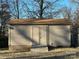 Tan colored storage shed with double doors and ramp at 108 Greenview Dr, Kannapolis, NC 28081