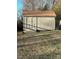 Tan colored storage shed with double doors at 108 Greenview Dr, Kannapolis, NC 28081