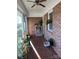 Sunroom with terracotta tile floor, cat tree, and storage at 108 Greenview Dr, Kannapolis, NC 28081