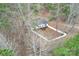 Overhead view of home featuring a white fence and large lot surrounded by mature trees at 114 Catawba Woods Ct, Belmont, NC 28012