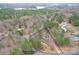 Aerial shot displays property location near Catawba Creek surrounded by dense forest at 114 Catawba Woods Ct, Belmont, NC 28012