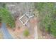 Aerial view of fenced backyard surrounded by mature trees at 114 Catawba Woods Ct, Belmont, NC 28012