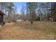 Spacious backyard with mature trees, offering plenty of room for outdoor activities and enjoyment at 114 Catawba Woods Ct, Belmont, NC 28012