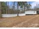 View of the fenced-in backyard and the home's exterior at 114 Catawba Woods Ct, Belmont, NC 28012