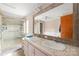 Modern bathroom boasts double sinks, a glass-enclosed shower, and contemporary finishes for a spa-like experience at 114 Catawba Woods Ct, Belmont, NC 28012