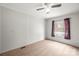 Bedroom includes neutral carpeting, and is flooded with natural light from the window at 114 Catawba Woods Ct, Belmont, NC 28012