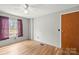 Bright and airy bedroom features wood floors, a ceiling fan, natural light, and ample space at 114 Catawba Woods Ct, Belmont, NC 28012