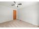 This bedroom features neutral carpeting and a closet door with brushed-gold hardware at 114 Catawba Woods Ct, Belmont, NC 28012