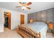 Relaxing bedroom with unique wall paneling, ceiling fan, and neutral tones that offer a calming retreat at 114 Catawba Woods Ct, Belmont, NC 28012